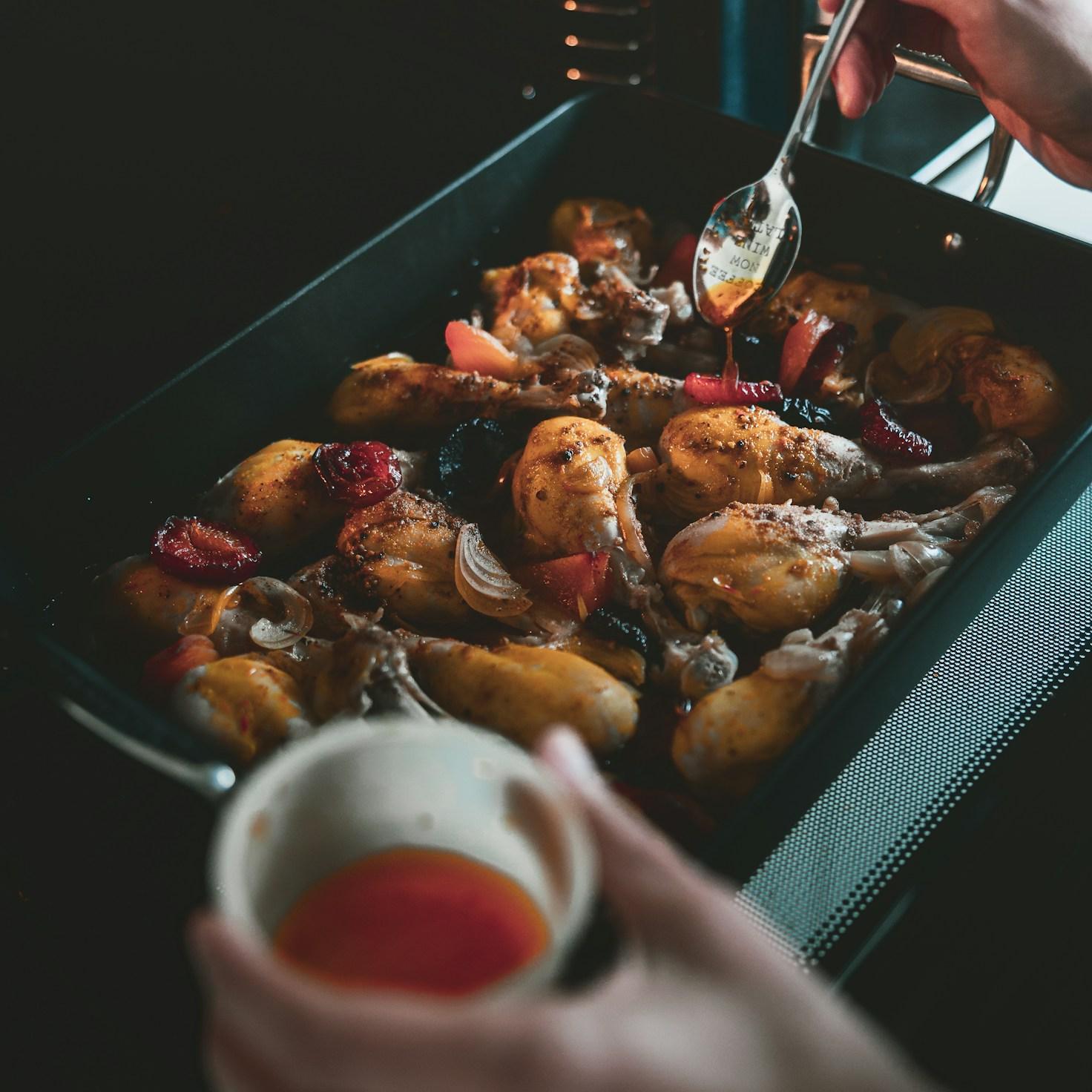 Community members collaborating in a modern kitchen space, sharing recipes and cooking techniques